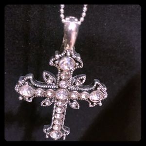 Necklace with cross pendant.